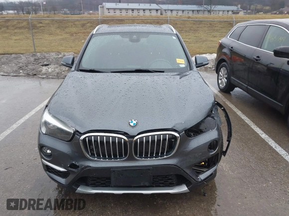 2019 BMW X1 sDrive28i with VIN WBXHU7C52K5L12160, listed as a IAAI auction lot 41452244 with 59,344 mi miles and . Bid and sale history available at DreamBid. Image 13.