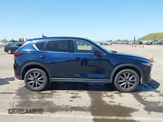 2018 Mazda CX-5 Grand Touring с VIN JM3KFBDM6J0326684, выставлен на аукционе IAAI как лот 42087646 с пробегом 111 192 миль миль и . История ставок и продаж доступна на DreamBid. Изображение 13.