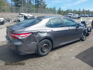 2019 Toyota Camry Hybrid LE z VIN 4T1B31HK0KU509265, wystawiony jako IAAI lot #42014204 z przebiegiem 136 560 mil mil oraz . Historia ofert i sprzedaży dostępna na DreamBid. Obrazek 4.
