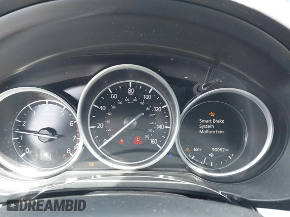2020 Mazda CX-5 Touring with VIN JM3KFACM9L0785464, listed as a IAAI auction lot 42023311 with 90,062 mi miles and . Bid and sale history available at DreamBid. Image 7.