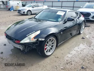 2013 Nissan 370Z with VIN JN1AZ4EH9DM880407, listed as a IAAI auction lot 42078526 with 216,029 mi miles. Bid and sale history available at carsss.com. Image 2.