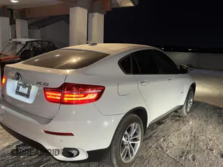 2014 BMW X6 xDrive35i with VIN 5UXFG2C58E0H09681, listed as a Copart auction lot 83922494 with 120,170 mi miles and Salvage Title. Bid and sale history available at carsss.com. Image 4.
