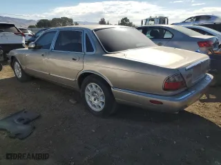 1998 Jaguar XJ with VIN SAJHX1248WC818587, listed as a Copart auction lot 74418114 with 112,395 mi miles and Clean Title. Bid and sale history available at carsss.com. Image 2.
