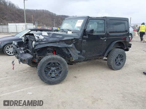 2014 Jeep Wrangler Sahara with VIN 1C4AJWBG9EL311477, listed as a IAAI auction lot 41884255 with 82,221 mi miles and . Bid and sale history available at carsss.com. Image 2.