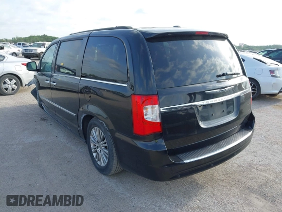 2013 Chrysler Town & Country Touring L with VIN 2C4RC1CG9DR778449, listed as a IAAI auction lot 42045779 with 217,776 mi miles and . Bid and sale history available at DreamBid. Image 3.