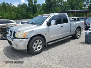 2004 Nissan Titan LE with VIN 1N6AA06A74N552585, listed as a Copart auction lot 62823815 with 266,567 mi miles and Salvage title. Bid and sale history available at DreamBid. Image 1.