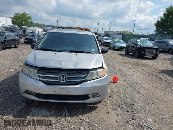 2012 Honda Odyssey EX-L with VIN 5FNRL5H61CB081634, listed as a IAAI auction lot 42760909 with 197,949 mi miles and . Bid and sale history available at DreamBid. Image 13.