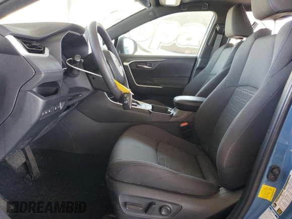 2022 Toyota RAV4 Hybrid SE with VIN 4T3T6RFV7NU103423, listed as a Copart auction lot 59709215 with 27,595 mi miles and Salvage title. Bid and sale history available at DreamBid. Image 7.