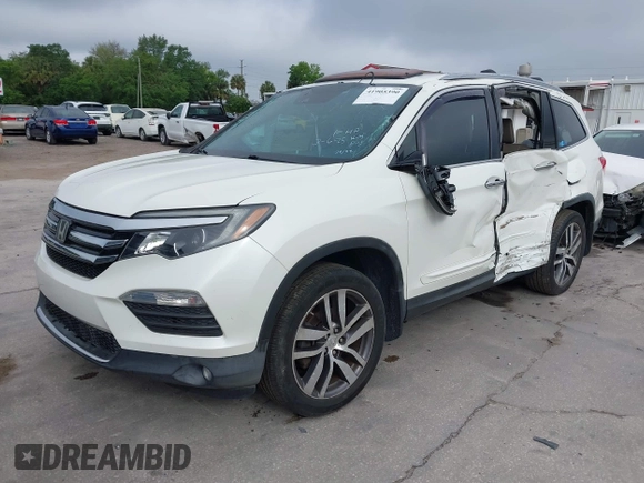 2016 Honda Pilot Elite with VIN 5FNYF6H00GB104329, listed as a IAAI auction lot 41905390 with 125,501 mi miles. Bid and sale history available at carsss.com. Image 2.