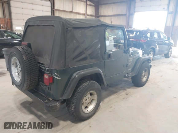 2000 Jeep Wrangler Sport with VIN 1J4FA49S2YP712526, listed as a IAAI auction lot 42151725 with 99,416 mi miles. Bid and sale history available at carsss.com. Image 4.