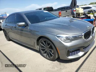 2017 BMW 7 Series 740i with VIN WBA7E2C55HG739108, listed as a Copart auction lot 53304715 with 114,510 mi miles and Salvage title. Bid and sale history available at DreamBid. Image 4.