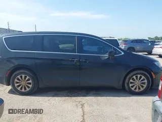 2017 Chrysler Pacifica Touring with VIN 2C4RC1DG6HR509717, listed as a IAAI auction lot 42228096 with 86,956 mi miles and . Bid and sale history available at DreamBid. Image 13.