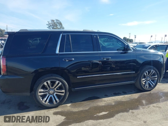 2019 GMC Yukon Denali with VIN 1GKS2CKJ4KR191886, listed as a IAAI auction lot 41198227 with 74,325 mi miles. Bid and sale history available at carsss.com. Image 13.