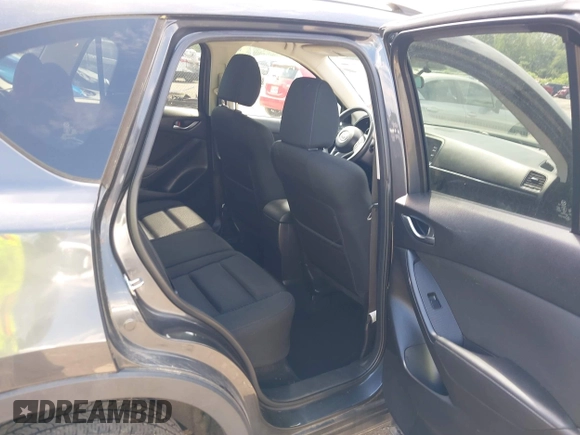 2015 Mazda CX-5 Touring with VIN JM3KE4CY9F0506879, listed as a IAAI auction lot 42209768 with 87,690 mi miles and . Bid and sale history available at DreamBid. Image 8.