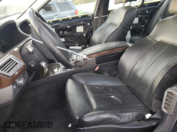 2006 BMW 7 Series 750i with VIN WBAHL83506DT05674, listed as a Copart auction lot 77176834 with 263,495 mi miles and Salvage title. Bid and sale history available at DreamBid. Image 7.