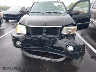 2007 GMC Envoy SLE with VIN 1GKDS13S872309605, listed as a IAAI auction lot 41946509 with 184,638 mi miles. Bid and sale history available at carsss.com. Image 6.