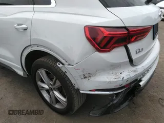 2022 Audi Q3 S line Premium Plus z VIN WA1EECF31N1045258, wystawiony jako IAAI lot #42299558 z przebiegiem 19 332 mil mil oraz . Historia ofert i sprzedaży dostępna na DreamBid. Obrazek 6.