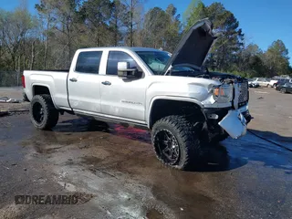 2015 GMC Sierra 2500HD available WiFi Denali with VIN 1GT120E87FF173940, listed as a IAAI auction lot 41843586 with 167,992 mi miles. Bid and sale history available at carsss.com. Image 1.