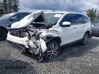2016 Honda Pilot Elite with VIN 5FNYF6H05GB062868, listed as a IAAI auction lot 41804794 with 1 mi miles. Bid and sale history available at carsss.com. Image 2.