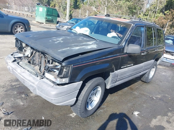 1996 Jeep Grand Cherokee Laredo with VIN 1J4GZ58S9TC268615, listed as a IAAI auction lot 41527984 with 248,443 mi miles. Bid and sale history available at carsss.com. Image 17.