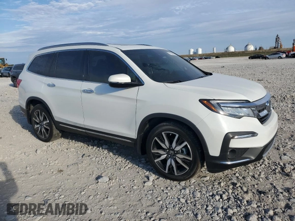 2022 Honda Pilot Touring 7-Passenger with VIN 5FNYF5H65NB011768, listed as a Copart auction lot 74134503 with 27,517 mi miles and Salvage title. Bid and sale history available at DreamBid. Image 4.