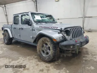 2020 Jeep Gladiator Rubicon z VIN 1C6JJTBGXLL136627, wystawiony jako IAAI lot #42333468 z przebiegiem 74 717 mil mil oraz . Historia ofert i sprzedaży dostępna na DreamBid. Obrazek 1.