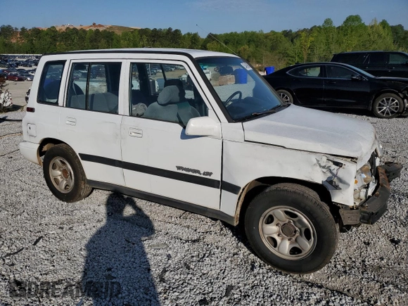 1997 Geo Tracker LSi z VIN 2CNBE1360V6927915, wystawiony jako Copart lot #53469605 z przebiegiem 119 413 mil mil oraz Szkoda całkowita • Salvage title. Historia ofert i sprzedaży dostępna na DreamBid. Obrazek 4.