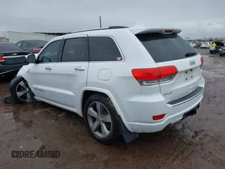 2014 Jeep Grand Cherokee Overland with VIN 1C4RJFCG9EC162098, listed as a IAAI auction lot 41746022 with 120,588 mi miles and . Bid and sale history available at DreamBid. Image 3.