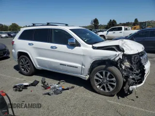 2017 Jeep Grand Cherokee Overland with VIN 1C4RJFCT5HC777748, listed as a Copart auction lot 63121635 with 106,991 mi miles and Salvage title. Bid and sale history available at DreamBid. Image 4.