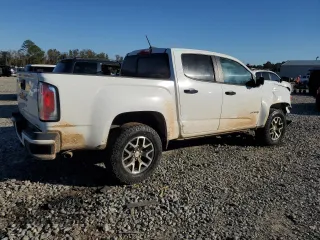 2021 GMC Canyon 4WD AT4 w/Cloth with VIN 1GTG6FEN9M1216062, listed as a Copart auction lot 80932634 with 73,308 mi miles and Salvage Title. Bid and sale history available at carsss.com. Image 3.