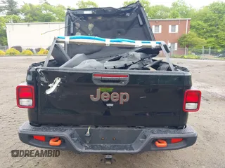 2021 Jeep Gladiator Mojave z VIN 1C6JJTEG9ML605638, wystawiony jako IAAI lot #40302253 z przebiegiem 32 019 mil mil oraz . Historia ofert i sprzedaży dostępna na DreamBid. Obrazek 16.
