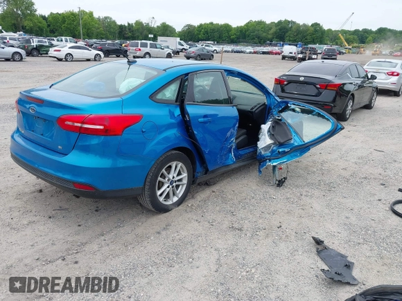 2015 Ford Focus SE z VIN 1FADP3F26FL252212, wystawiony jako IAAI lot #42345763 z przebiegiem 102 549 mil mil oraz . Historia ofert i sprzedaży dostępna na DreamBid. Obrazek 4.