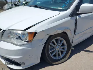 2014 Dodge Grand Caravan SXT with VIN 2C4RDGCG1ER429495, listed as a IAAI auction lot 42058513 with 136,936 mi miles and . Bid and sale history available at DreamBid. Image 6.