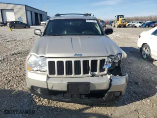 2010 Jeep Grand Cherokee Laredo with VIN 1J4RR4GT1AC106990, listed as a Copart auction lot 87421664 with 106,025 mi miles and Salvage Title. Bid and sale history available at carsss.com. Image 5.