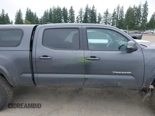2021 Toyota Tacoma SR5 with VIN 3TMDZ5BN1MM119711, listed as a IAAI auction lot 42479038 with 64,779 mi miles and . Bid and sale history available at DreamBid. Image 14.