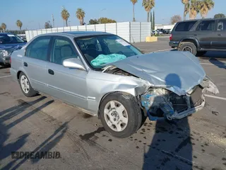 1999 Honda Civic EX with VIN JHMEJ8648XS000823, listed as a IAAI auction lot 41479594 with 299,294 mi miles. Bid and sale history available at carsss.com. Image 1.