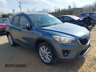 2015 Mazda CX-5 Grand Touring with VIN JM3KE4DY5F0469098, listed as a IAAI auction lot 41858792 with 174,883 mi miles. Bid and sale history available at carsss.com. Image 1.