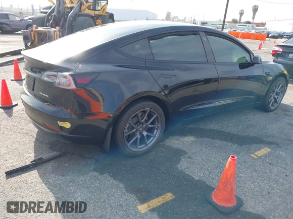 2022 Tesla Model 3 Long Range with VIN 5YJ3E1EB6NF233131, listed as a IAAI auction lot 41819409 with 38,308 mi miles and . Bid and sale history available at DreamBid. Image 4.