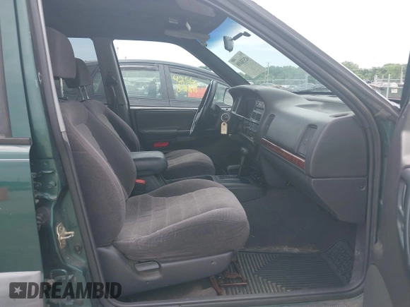 1998 Jeep Grand Cherokee Laredo with VIN 1J4GZ58S7WC284106, listed as a IAAI auction lot 42558498 with 316,354 mi miles and . Bid and sale history available at DreamBid. Image 5.