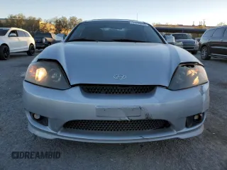 2005 Hyundai Tiburon GT z VIN KMHHN65F05U171038, wystawiony jako Copart lot #87765735 z przebiegiem 113 129 mil mil oraz Szkody całkowita. Historia ofert i sprzedaży dostępna na DreamBid. Obrazek 5.
