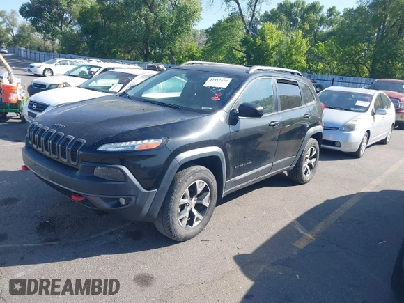 2015 Jeep Cherokee Trailhawk with VIN 1C4PJMBS4FW556822, listed as a IAAI auction lot 42412874 with 129,865 mi miles and . Bid and sale history available at DreamBid. Image 2.