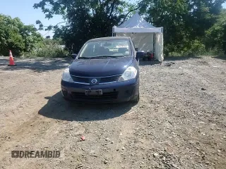 2007 Nissan Versa 1.8 SL with VIN 3N1BC11E27L432802, listed as a Copart auction lot 71018594 with 118,795 mi miles and Salvage Title. Bid and sale history available at carsss.com. Image 11.