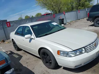 2003 Cadillac Seville Touring STS with VIN 1G6KY54963U110607, listed as a IAAI auction lot 42080691 with 79,605 mi miles. Bid and sale history available at carsss.com. Image 1.