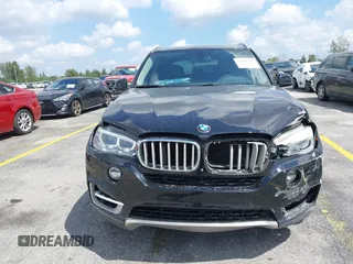 2016 BMW X5 xDrive50i with VIN 5UXKR6C51G0J81658, listed as a IAAI auction lot 41801382 with 34,572 mi miles. Bid and sale history available at carsss.com. Image 13.