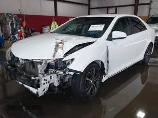 2014 Toyota Camry L with VIN 4T1BF1FKXEU306754, listed as a IAAI auction lot 41613218 with 195,692 mi miles. Bid and sale history available at carsss.com. Image 2.