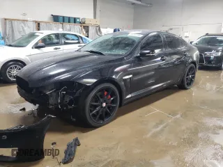 2012 Jaguar XF Portfolio with VIN SAJWA0HB1CLS33984, listed as a Copart auction lot 85264994 with 79,355 mi miles and Salvage Title. Bid and sale history available at carsss.com. Image 1.