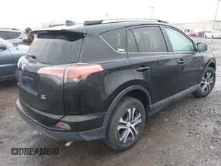 2018 Toyota RAV4 LE with VIN 2T3BFREV2JW788700, listed as a IAAI auction lot 41986212 with 87,704 mi miles. Bid and sale history available at carsss.com. Image 4.