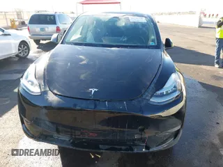 2023 Tesla Model Y Long Range with VIN 7SAYGDEE8PA151965, listed as a IAAI auction lot 41343497 with 25,869 mi miles. Bid and sale history available at carsss.com. Image 12.