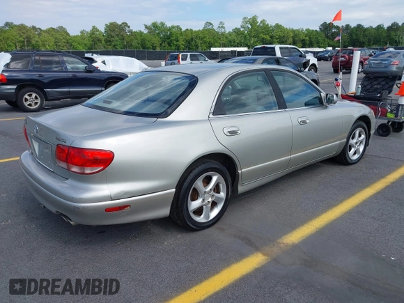 2002 Mazda Millenia with VIN JM1TA221721722364, listed as a IAAI auction lot 42160683 with 166,778 mi miles and . Bid and sale history available at DreamBid. Image 4.
