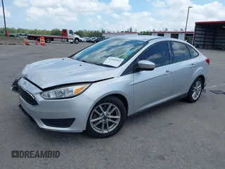 2018 Ford Focus SE z VIN 1FADP3FE9JL241661, wystawiony jako IAAI lot #42103513 z przebiegiem 117 003 mil mil oraz . Historia ofert i sprzedaży dostępna na DreamBid. Obrazek 17.
